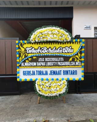 Papan Bunga Duka di Moya
